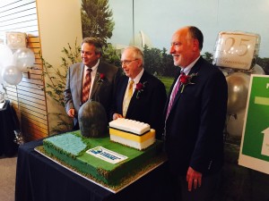 Dean Curtland, Ed Brown, and Ted Feigenbaum get ready to cut cake.